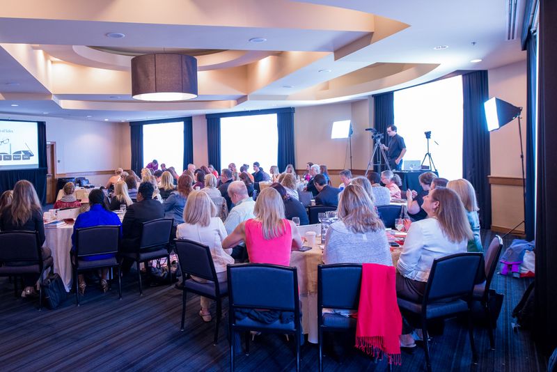 Conference room full of people at a corporate event